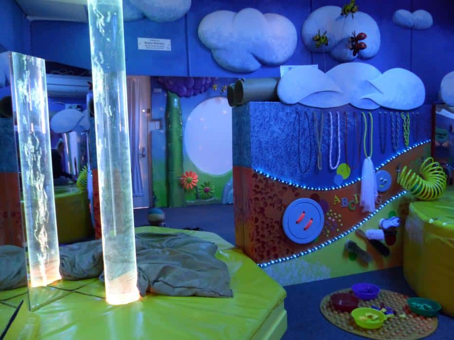 Multi-sensory room with lights, textured surfaces and bubble tube
