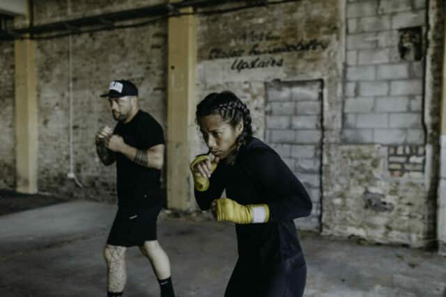 Image of man and woman doing boxing training